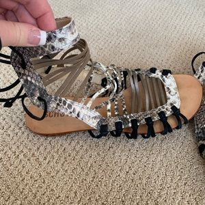 Schultz Snakeskin Print Gladiator Sandals with Black and Tan Details